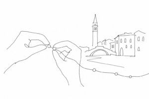 Mani che infilano perle con profilo essenziale di Venezia